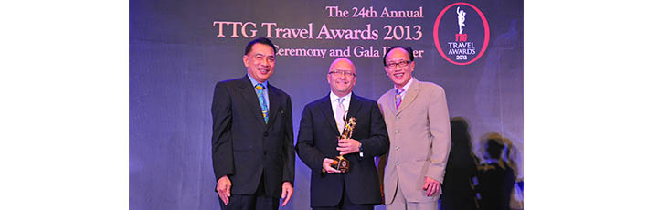 Qatar Airways Chief Commercial Officer, Marwan Koleilat (centre) accepts the award for Best Middle Eastern Airline at the TTG Asia Awards 2013 held in Bangkok. With him are Nopparat Maythaveekulchai, President of the Thailand Convention & Exhibition Bureau (left) and Michael Chow, Group Publisher of TTG Travel Trade Publishing.