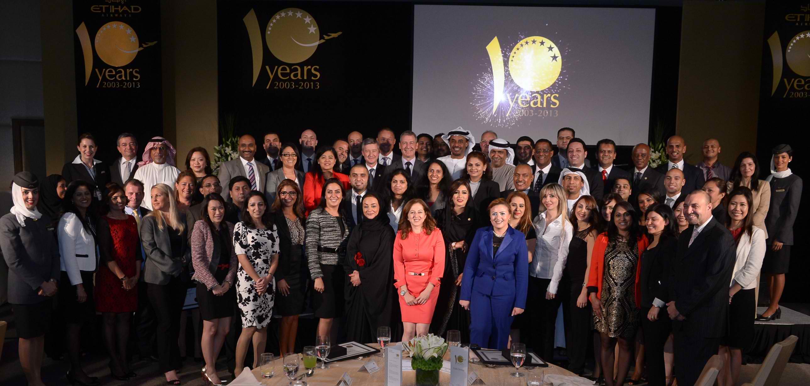 Etihad Airways longest serving staff members celebrate their ten-year achievements with airline management executives. 