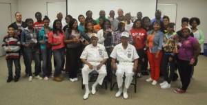 Tuskegee Airmen Beverly Dunjill and Milton Williams Jr. (front row) meet with CAPS Safe Summer students at the CDA