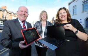 Roberta Richmond from East Belfast Community Counselling shows Human Resources and Corporate Responsibility Director at Belfast City Airport Michelle Hatfield and east Belfast councillor Jim Rodgers the benefit of being mobile. 