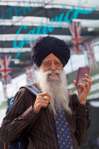 Fauja Singh, the winner of Gatwick Airport's UK's oldest traveller competition, arrives at Gatwick's North Terminal