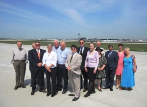 Union League Club members stop for a quick photo during tour of airfield at O'Hare International Airport on August 23, 2012