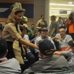 A "Legacy Girl" greets WWII veterans at Midway