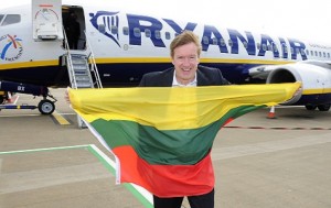 Leeds Bradford Airport’s Commercial Director, Tony Hallwood, flies the Lithuanian flag to celebrate the launch of the new route to Vilnius
