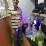 Dr. James Umen in his Danforth/Enterprise algae lab. His grow lights are impressive. (Jim Motavalli photo)