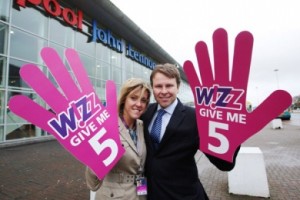 Wizz Air's Nora Bartha with Matthew Thomas, Commercial Director for Peel Airports giving ‘High 5's' at Liverpool John Lennon Airport