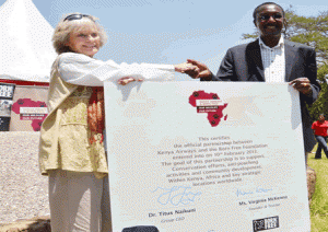Ms Virginia Mckenna - Founder and trustee of Born Free Foundation shakes hands with Dr Naikuni after the signing ceremony held the at Nairobi National Park 