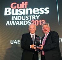Tim Clark, President, Emirates Airline, (left) receives the award for UAE Company of The Year from Ian Fairservice, Motivate Publishing Managing Partner and Group Editor, at The Gulf Business Industry Awards 2013 held last night in Dubai.