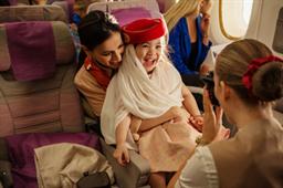 One of Emirates’ much-loved onboard experiences, the popular instant photograph in an iconic Emirates cabin crew hat.