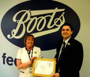 Margi receives her award from Mark Daly, Boots Terminal Manager here at the Airport