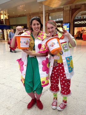 L-R: Doctors Whoopee and Dotty at Waterloo station collecting for the Giggle Doctors