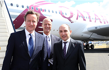 UK Prime Minister the Right Honourable David Cameron, alongside the Chief Executive of Airbus Group Tom Enders with His Excellency Mr Akbar Al Baker, CEO of Qatar Airways, standing next to the Airbus A350.