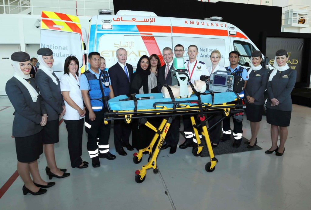 Senior Etihad Airways and National Ambulance executives pose with the new ambulance.