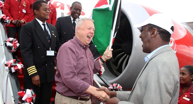 Kenya Airways Fleet & Asset Development Director Rick Sine hands over the flag to the Group CEO Dr. Titus Naikuni, upon arrival from Charleston, USA to deliver the airline’s third Dreamliner. Looking on is Captain John Mathias Kimani who flew the aircraft. 