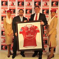 Golden Lions Rugby Union CEO Rudolf Straeuli (right) presents Emirates Senior Vice President Orhan Abbas (left) with the new Emirates Lions jersey