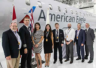  Representatives of Mesa Airlines and Bombardier with the newest CRJ900 aircraft in American Eagle colours