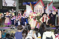Students from the Hong Kong Academy for Performing Arts perform songs from 'The Sound of Music' and enjoy a pleasant summer time with passengers.