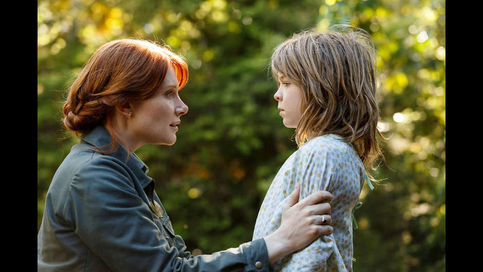Bryce Dallas Howard plays Grace and Oakes Fegley is Pete in Disneys' Pete's Dragon, the adventure of an orphaned boy and his best friend Elliot, who just so happens to be a dragon. CREDIT: Matt Klitscher / Disney Enterprises