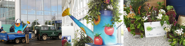 Bristol Airport hosts Cleeve Nursery’s giant-sized watering can as part of the Chelsea Fringe Festival