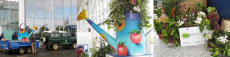 Bristol Airport hosts Cleeve Nursery’s giant-sized watering can as part of the Chelsea Fringe Festival 